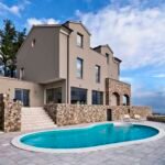 exteriors-view-of-a-modern-villa-in-the-foreground-the-swimming-pool.jpg